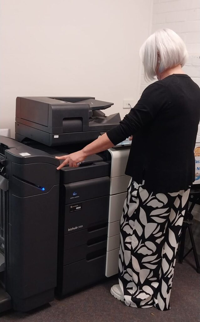 lady using the printer in a school