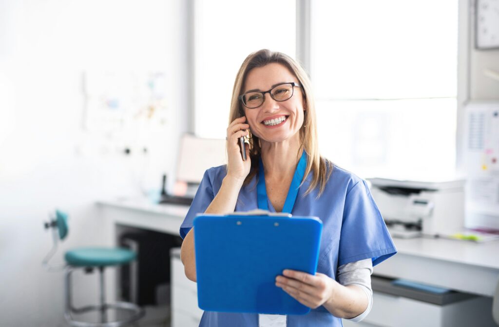 nurse on the phone with a clipboard