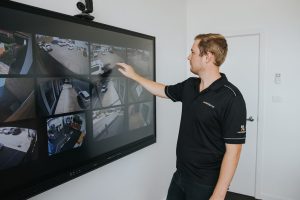 man using interactive touch screen with security software
