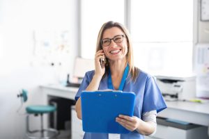 getty-images-CLW-pSwSro4-unsplash nurse on the phone with a clipboard
